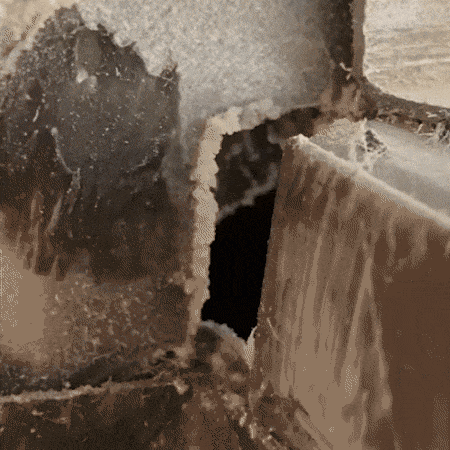 Time-lapse animation showing Aeroseal sealant particles collecting in duct gaps and cracks